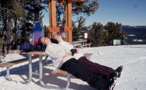 1997 Two girls on a bench at the summit in fromt of Mike Bell's Bell