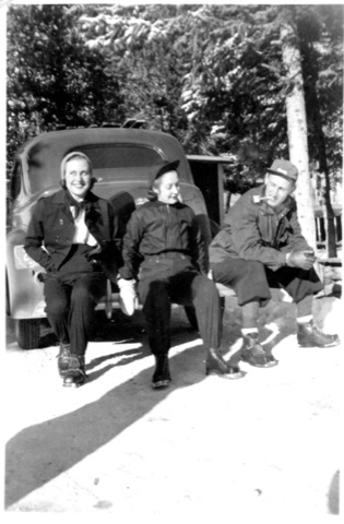 1941 2 women and man with pipe sitting on back of truck -Donated by Donna Wahlberg