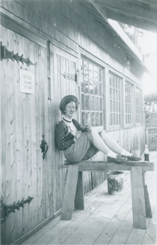 1951 The Lodge — Woman in front of the lodge door
