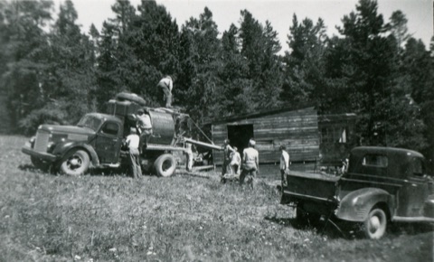 1952 Men Pouring cement with 2 trucks