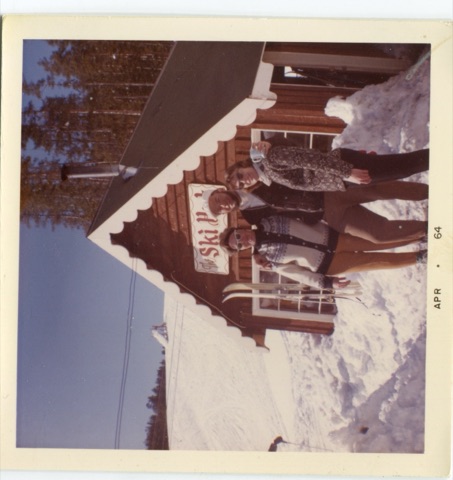 Jim Hasterlik and two others in the snow outside the Ski Hut he built at Kings Hill