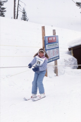 1989 Girl going up rope tow and smiling - Frank Ball Photo 34