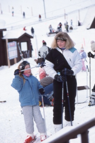 1989 Woman and girl near lodge - Frank Ball Photo