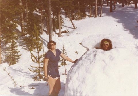 1970s Stan King in snow cave popping his head out, unknown woman