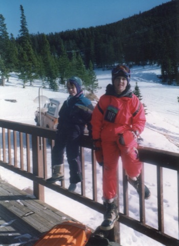 1990s Unknown kid with Charley Willett on lodge deck