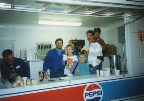 1990s Allan Rabbit — Concession Stand — Group of people at a Ski Patrol Benefit in a Pepsi trailer