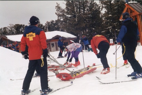 1990s Top Rock — Ski Patrollers with Toboggans on Tacky Attire Day