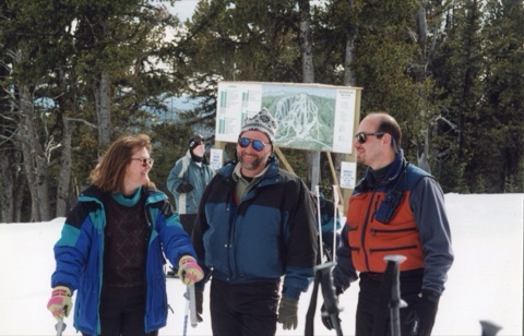 1999 Trail Map at the top of the mountain — People smiling and talking