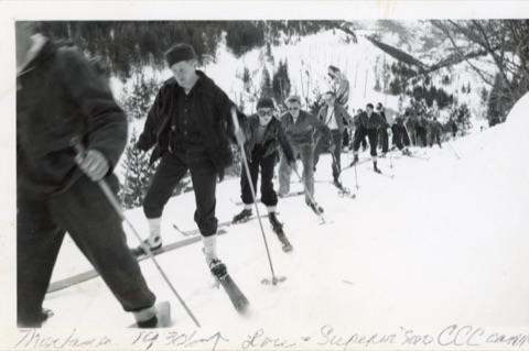 1936 Lou Demorest and CC skiing with train in background