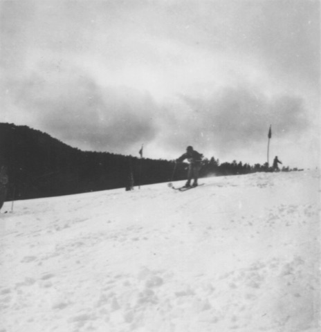 1940s Racer between pennant gates on a crest