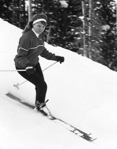 1960s A young woman skiing toward the camera
