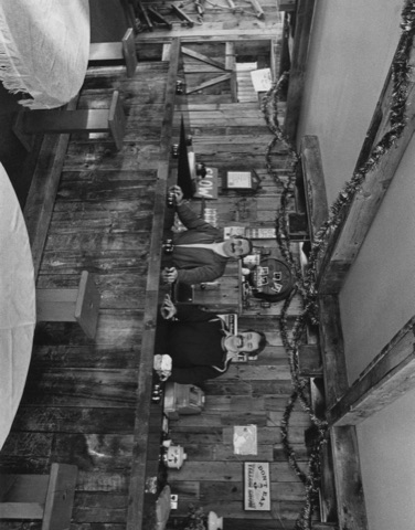 1970s Two men behind the bar